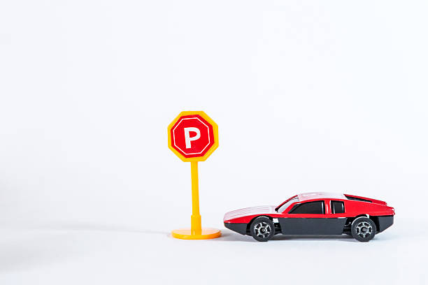 istock Sport car model with parking sign isolate on white background 2211565132