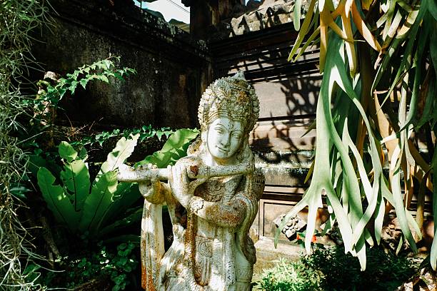 istock Serene garden statue amidst lush greenery 2211565376
