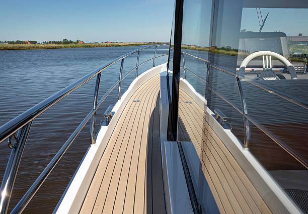 Black and white image of a boat cruising