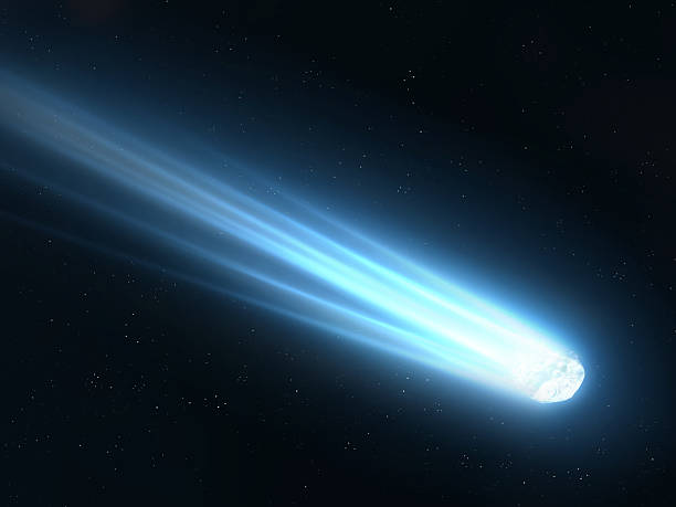 istock Glowing comet with a long tail. Beautiful meteor on a black background. 2211570032