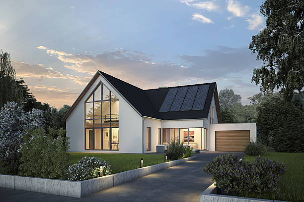 istock Modern house with a glass front and solar cells in the evening 2211570372