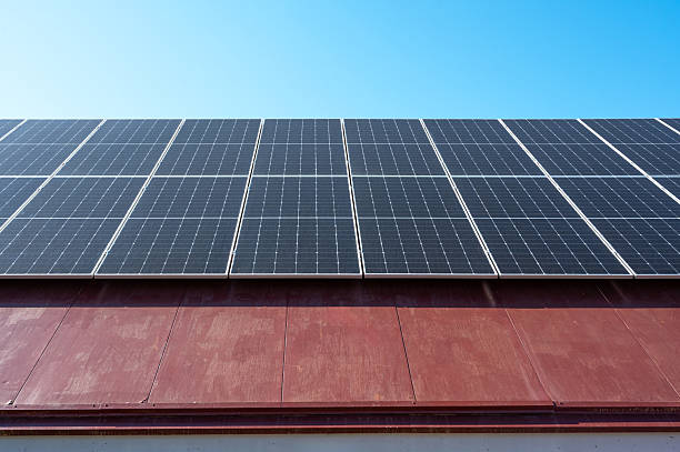 istock Solar panels converting sunlight into renewable energy on a rooftop 2211572037