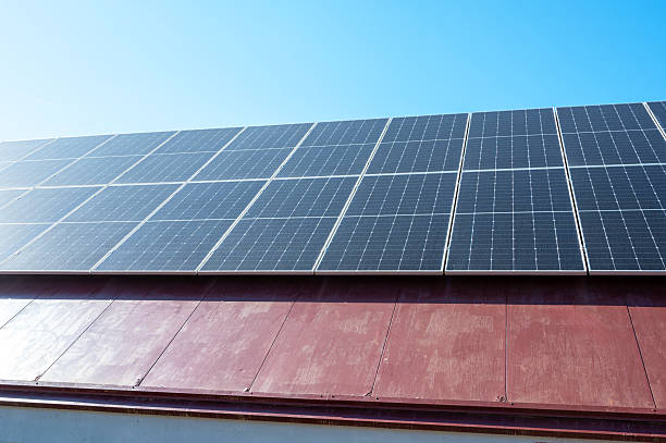 istock Solar panels converting sunlight into renewable energy on a rooftop 2211572056