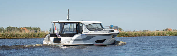 Luxury yacht. Yachting in the Netherlands. Sailing at the canals of Friesland