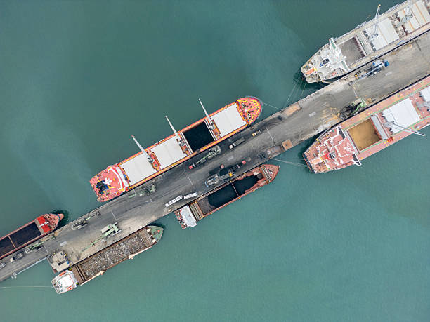 istock Aerial view of bulk carrier loading from truck 2211575656