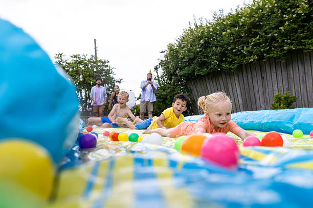 istock Outdoor Slip and Slide Play 2211576295
