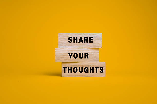 istock share you thoughts on wooden blocks isolated on orange background 2211578633
