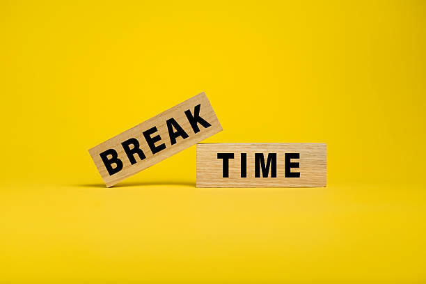 istock break time words text on wooden blocks isolated on yellow background 2211578676