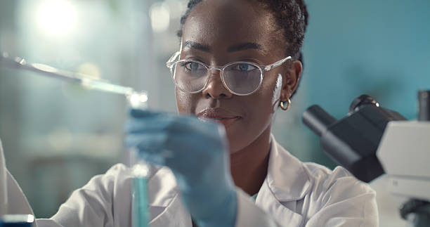 istock Science, sample and black woman with liquid in lab for research, medical study and forensic data. Healthcare, pharmaceutical and scientist with test tube for experiment, discovery and breakthrough 2211578738