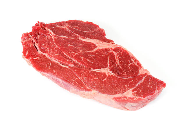 istock fresh raw rib eye steak on white background 2211583979