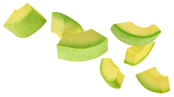 istock Levitating Avocado pieces isolated on white. Flying Avocado fruit slices. Avocado Explosion. Top view. Flat lay. Package design element 2211584938
