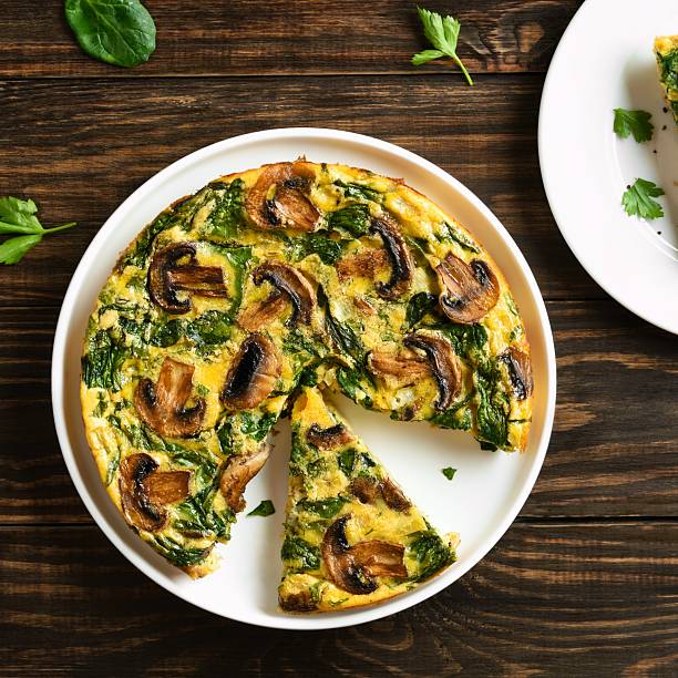 istock Frittata with spinach and champignon mushrooms 2211585548