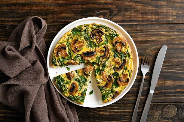 istock Frittata with spinach and champignon mushrooms 2211585595