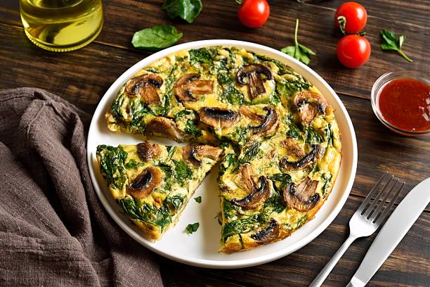 istock Frittata with spinach and champignon mushrooms 2211585617