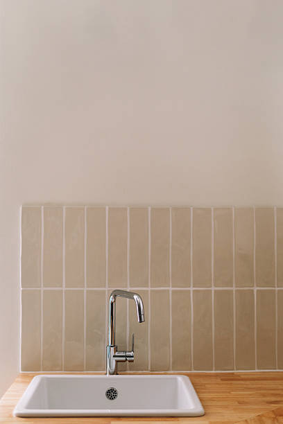 istock Minimalist kitchen sink area in neutral tones, modern residential design 2211586983