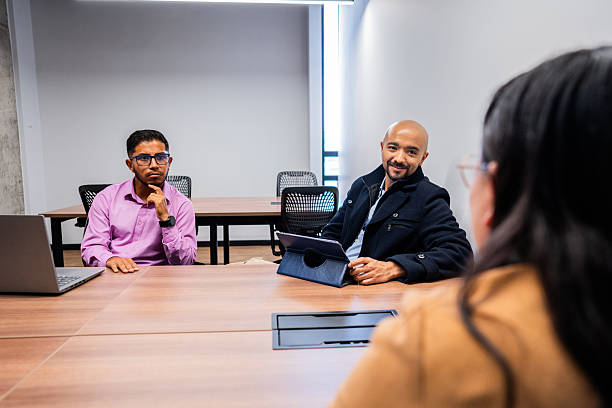 istock Coworkers talking on the office 2211589437