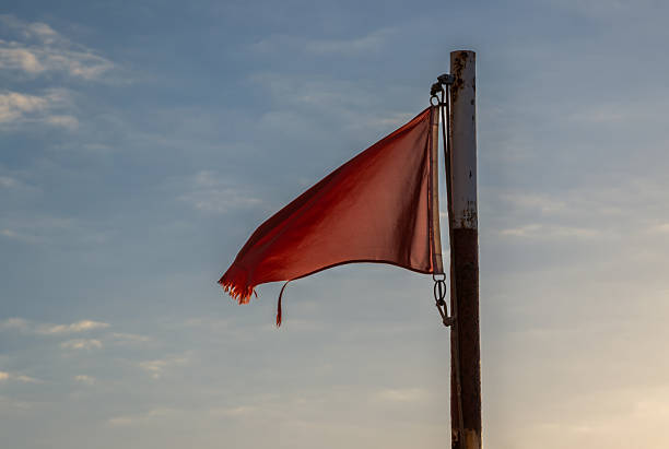 Row of multi colored maritime signal flags hanging. Decoration on top of fishing boat , Virgen del Carmen traditional festival, Burela harbor, Lugo province, Galicia, Spain.