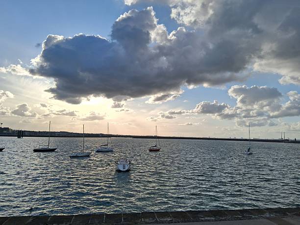 Racing sailboats at the seafront of Thessaloniki, Greece at sunset