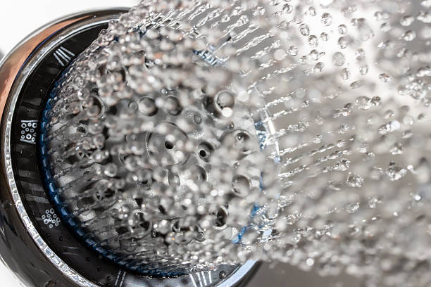 istock The water drops running from the shower head, close up view. 2211593257
