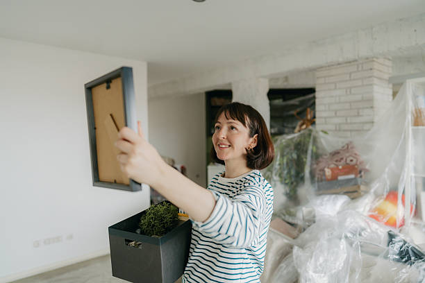 istock Young woman moving into a new home 2211596370