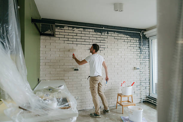 istock A man painting the wall 2211596372