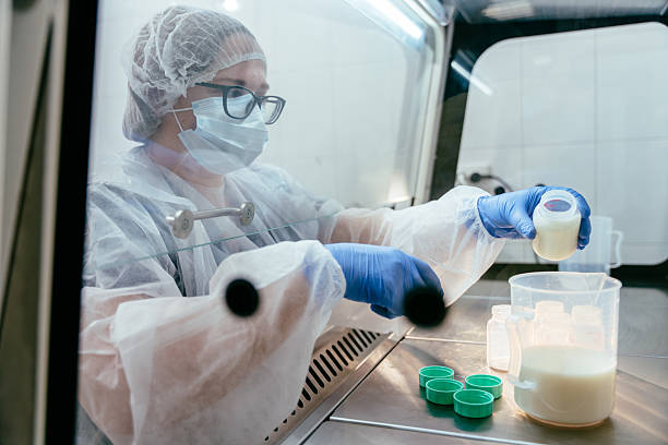 istock Lab technician handling breast milk samples in hood 2211596426