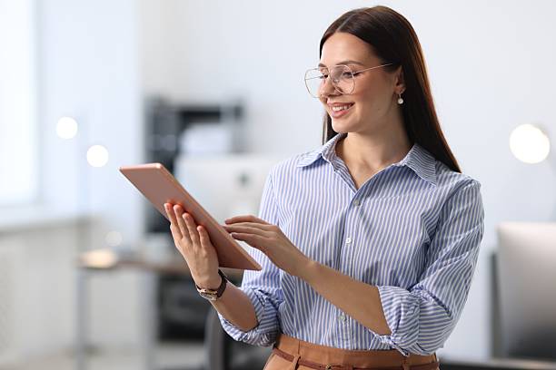 istock Portrait of banker using tablet in office 2211601993