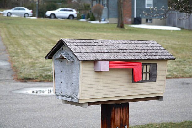 mailbox in house shape exterior in residential area