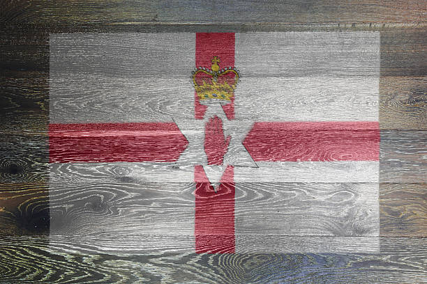 istock Northern Ireland flag on rustic old wood background 2211607207