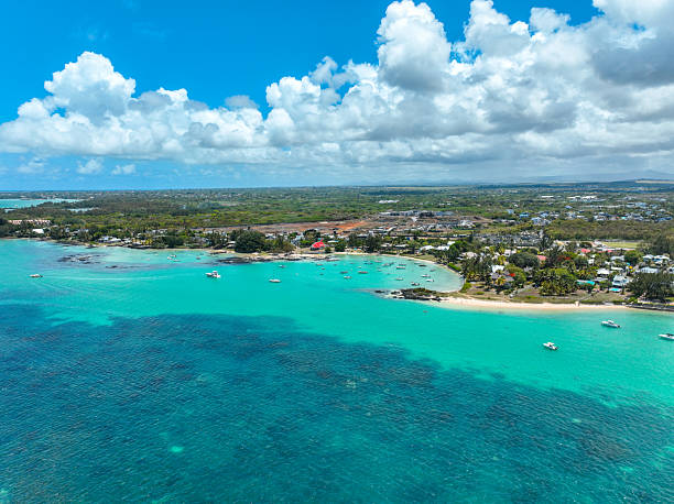 istock Sandy beach and turquoise bay in Grand Baie 2211617441