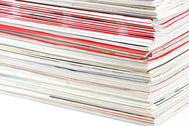 istock close up on stacking magazines isolated on white background 2211618633