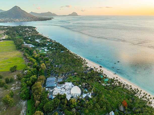 istock Resort rooftops and lagoon in golden hour 2211620449