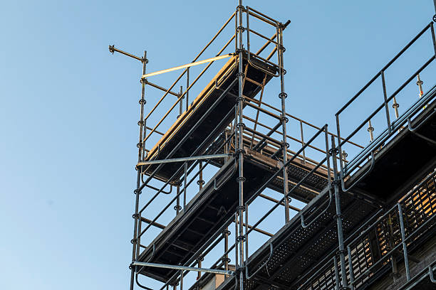 istock Close-up of scaffolding with a blue sky 2211620496