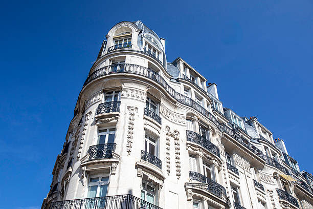 istock Ornate Paris apartment building with a clear blue sky 2211621506