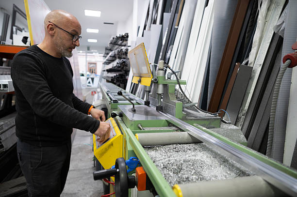 istock Carpenter working with aluminum profiles in workshop 2211621572