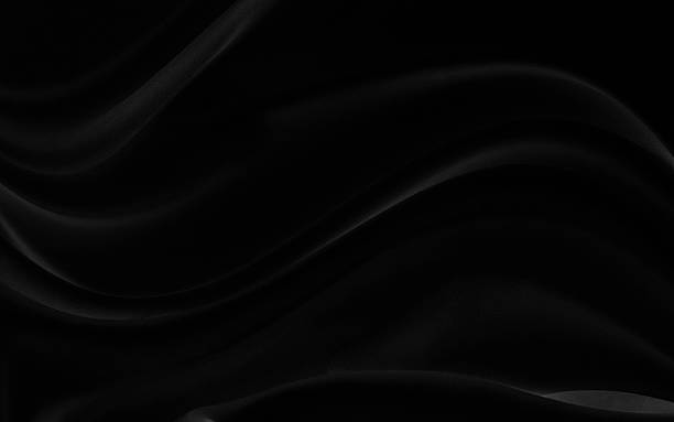 istock Black gray satin dark fabric texture luxurious shiny that is abstract silk cloth background with patterns soft waves blur beautiful. 2211621989