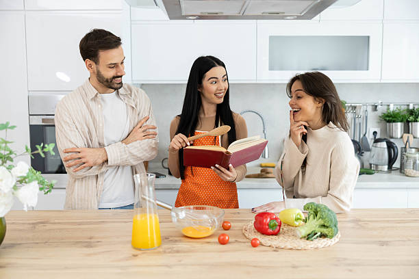 istock Cookbook and Friends in Cozy Kitchen 2211625430