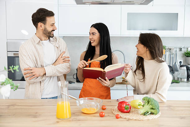 istock Friends Cooking Together in Modern Kitchen 2211625438