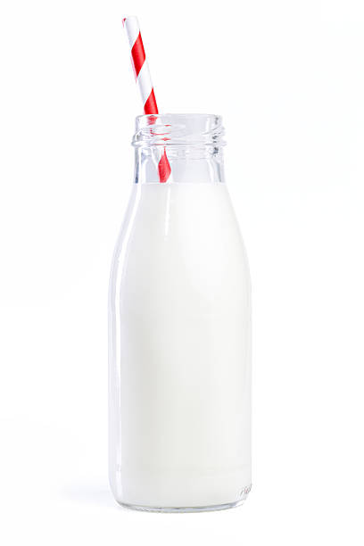 istock Glass milk bottle with red striped straw 2211626753