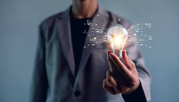 istock Human hand holding light bulb to illuminate. Innovation through ideas and inspiration ideas. idea of creativity and inspiration concept of sustainable business development. 2211628618