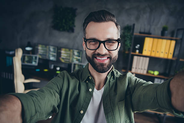 istock Self-portrait of attractive cheerful intellectual guy leader tech support developing web project at workplace workstation indoors 2211628703