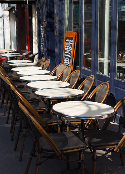 istock Paris, France: Row B&W Wicker Chairs, White Tables, Sidewalk Cafe 2211633851