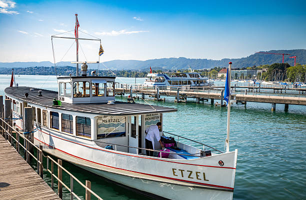 The 1926 passenger boat MS Etzel moored on Lake Zurich in Zurich, Switzerland. It is one of the oldest boats on the lake still operating.