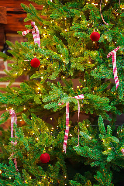 istock Christmas tree decorated with red balls and bows . 2211634680