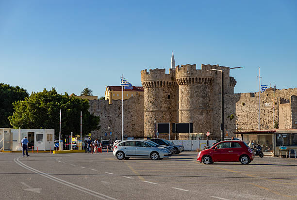Rhodes City, Rhodes, Greece - October 22, 2024: A picture of the Sea Gate, part of the Medieval Rhodes City Walls, as seen from the Kolona Harbor.