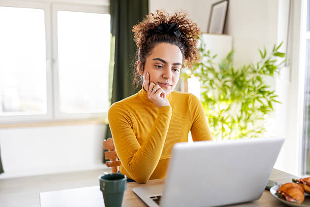 istock Cheerful Woman Starting Her Day Online 2211637328