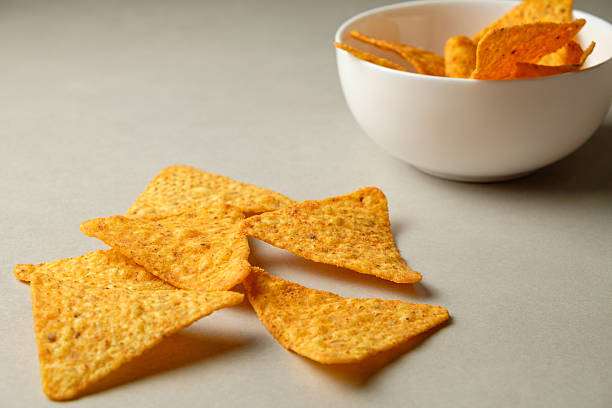 istock Delicious crispy nacho chips perfect for snacking during a cozy gathering 2211637477