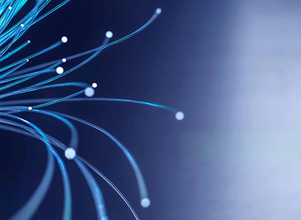 istock Blue optical fibers emitting light in an artistic, abstract image about technology and data. 2211637627
