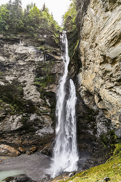 istock A Reichenbach Falls in Switzerland waterfall is flowing down a rocky cliff 2211639641