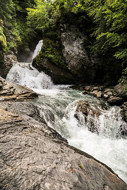 istock A Reichenbach fall in Switzerland waterfall is flowing down a rocky cliff 2211639743